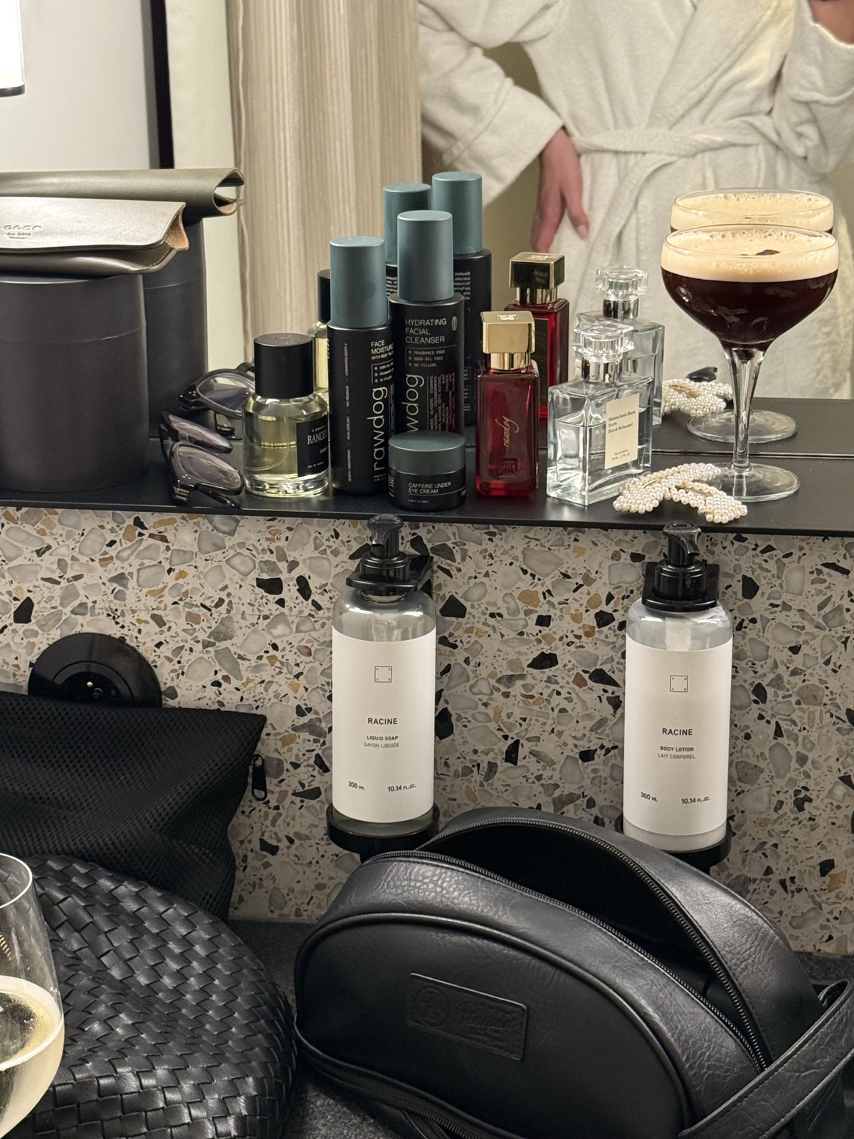 RAWDOG skincare products packed beside a travel toiletry bag