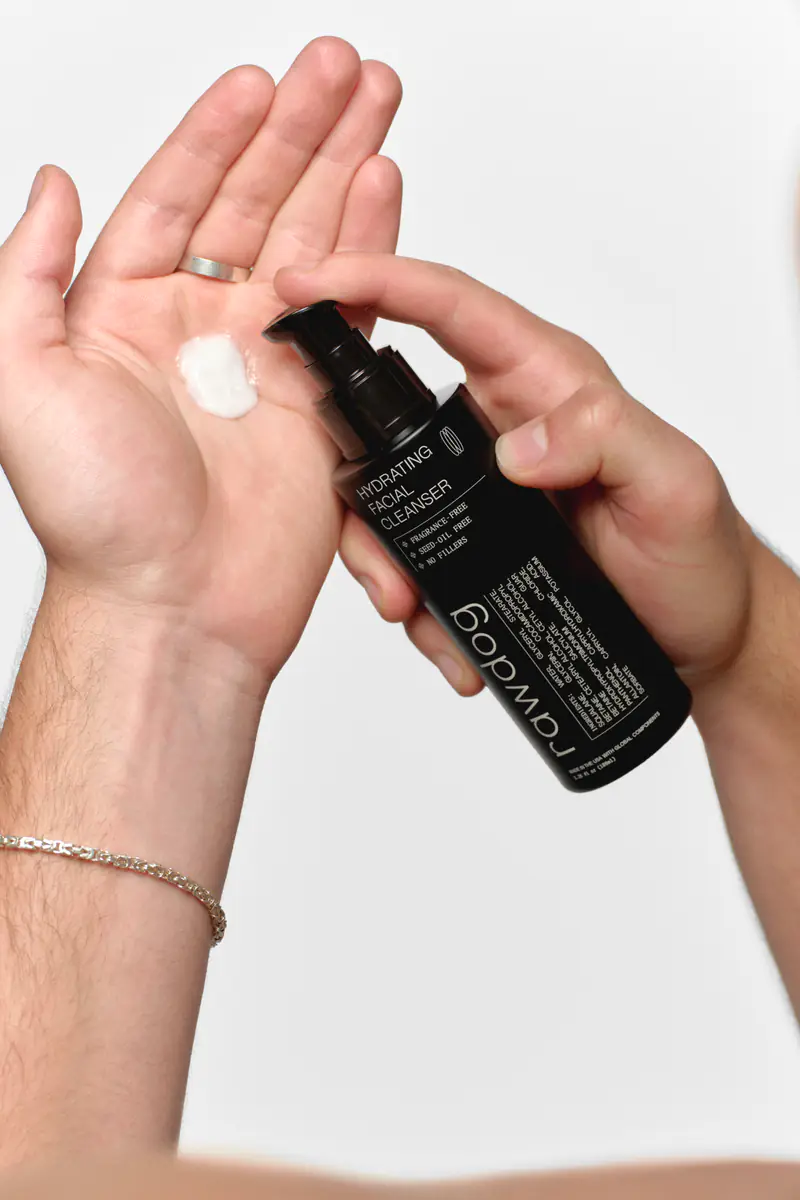 Man dispensing RAWDOG Hydrating Facial Cleanser into his palm