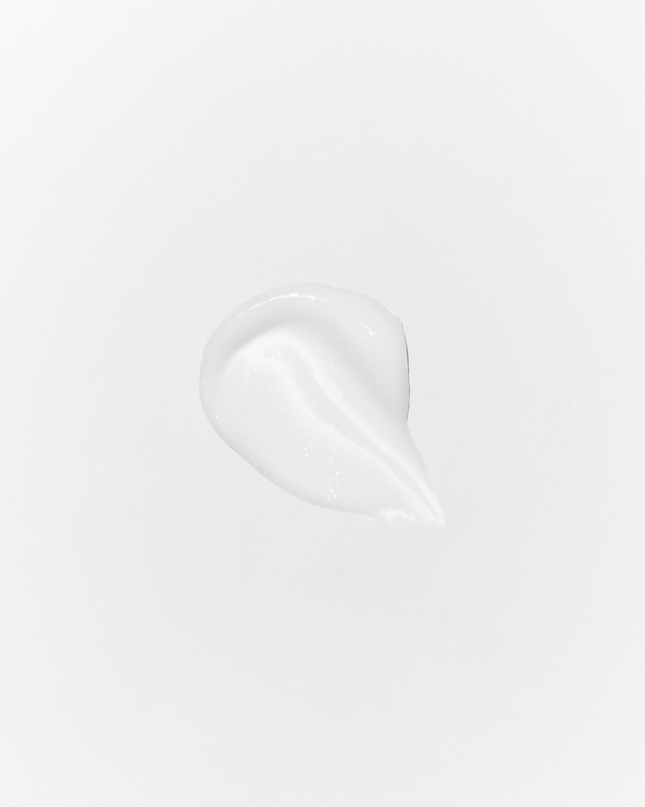 Swatch of RAWDOG Caffeine Under Eye Cream texture on a white background
